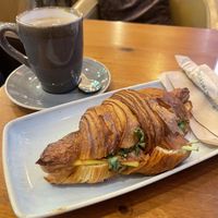 Vegan ham and cheese with coffee  at kave in West London