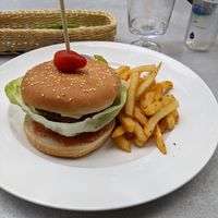 Burger with soy patty and vegan cheese (vegan) at Radharane - Gedimino in Vilnius