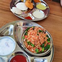 Idly, vada and sambar and Fried vegetables rice with side dishes at Saravanaa Bhavan in Berlin