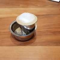 Fun fact: the coffee is to be poured into the bowl and back into the glass 2-3 times for uniform flavour at Saravanaa Bhavan in Berlin