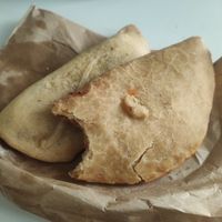 Empanadillas de calabacín y cebolla, y tomate at La Pastelería Llisó in Valencia