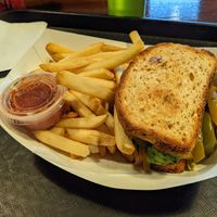Vegetarian Sandwich with gluten free bread, side of fries and side of salsa at Foodie Club in Grand Canyon Village