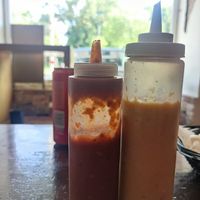 Vegan sauces, one spicy, one avocado-sweet pepper at Aguacate Latin Food in Vienna
