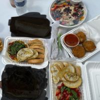 Caught them at Veg Fest in Ypsi 2023. Rosie Salad, Bruschetta as a dip with garlic bread, Arancini, Strawberry ricotta dip w/ garlic bread.   at Vegano Italiano - Food Truck in Ann Arbor