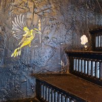 Steep stairs had pretty art on them (I imagine those are pieces of tofu the bird is carrying). at Satay in Antwerpen