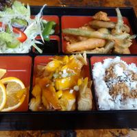 Vegan bento box: vegan duck with a mango sauce, rice, vegetable fritters, green salad, fruits at Little Tokyo in Leeds