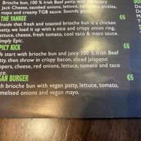 Closeup of the vegan burger on the menu. Fresh brioche bun with vegan patty, lettuce, tomato, caramalised onion and vegan mayo. at The Good Burger in Athy