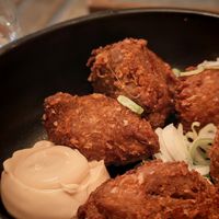 Kimchi stuffing with turnips and tofu, black sesame sauce, mustard pickles at brEAThe Restaurant | Sushi végétal à Paris in Paris