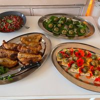 Empanadas with salsa and two kinds of cashew cheese balls on toast and rye bread at Proev in Alkmaar