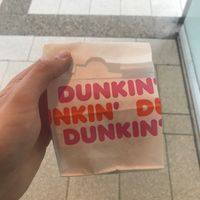 Dunkin' donut paper bag at Dunkin' in Vienna