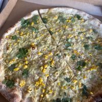 “Corny peener” NY style vegan pizza with roasted corn, cilantro, and a jalapeño sauce. Best ever  at TNT Pizza in San Diego