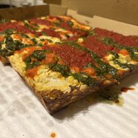 Gluten free Detroit style pizza made vegan, with tomato sauce, vodka sauce, pesto & add vegan ricotta   at TNT Pizza in San Diego