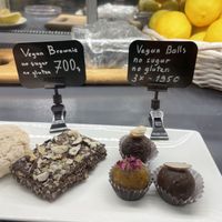 In the cold case - vegan brownie and v balls  at The Green Bean Cascade in Yerevan