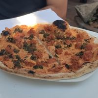 Vegan pizza with sunflower seed cheese and sausage. Yum! at Casa Xoxoctic in San Salvador