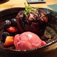 Vegan dessert. Chocoladecake met sorbetijs en fruit at Beautanica in Zwolle