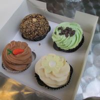 Ferrero Rocher, Mint Chocolate, Carrot Cake and Vanilla Cupcake. at Ms. Cupcake in South West London