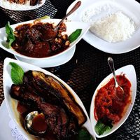 Portobellos w/pomegranate-walnut sauce, smoked eggplant dip, seared, braised eggplant w/basmati.  at Pomegranate On Main in Greenville