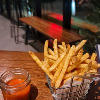 Fries with spicy dip at Wraptor in Bangkok