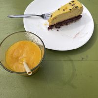 Amazing mango smoothie and nice cake.  at Alchemist Garden in Amsterdam