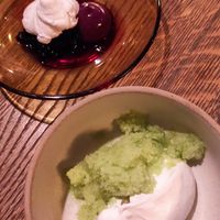 Two little desserts. Vegan cream mousse with green apple granita and cardamom (bottom); vegan creamy cheese mousse with chocolate spicy cream mousse, liquorous sauce made out of re at Matur og Drykkur in Reykjavik
