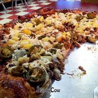 Bbq sauce base, topped with Daiya, mushrooms, artichoke, jalapeno, pineapple, and sorta-sausage.  So freaking good. at Rudy's Pizza in Portland
