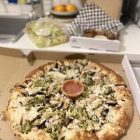 Vegan chicken & garlic pizza (+ broccoli added) with vegan Caesar salad and vegan wings  at Rudy's Pizza in Portland