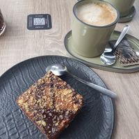 Chocolate brownie and oat latte at Natur Poke in Mallorca