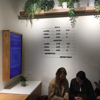 Insider venue; customers are sitting on one of the benches. at Oakberry - NoMad in New York City