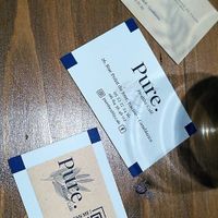 Business cards of the place, with a QR code to the menu (that I could not figure out on my phone ^^)  at Pure. Healthy Cafe in Casablanca