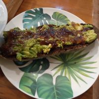 Tostada de pan de centeno con aguacate y cebolla caramelizada. at Massay in Granada