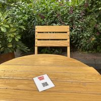 Outdoor seating w/digital menu  at Tamales Madre in Mexico City