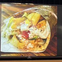 Picture on wall of a tasty pita wrap.  at Kefi Fast Fresh Mediterranean in Bend