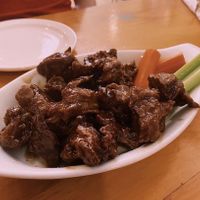 Wings covered in maple syrup and garlic sauce  at Rise Above in St Catharines