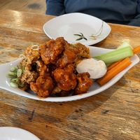 The seitan wings. Half are Sriracha lime, half are buffalo sauce. In the container is the lemon aïoli sauce.  at Rise Above in St Catharines