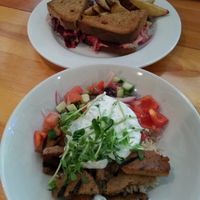 Seitan souvlaki bowl, and smoked beet reuben with potato wedges. YUM. at Rise Above in St Catharines