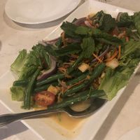 Fries tofu, green beans, tomato salad in a coconut lime dressing  at Araya's Place - University District in Seattle