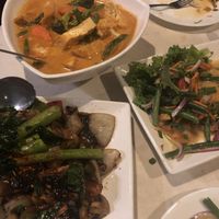 Top left: “Noodle Curry” - coconut curry with tofu, carrots, broccoli, asparagus, cauliflower. Bottom left: Seitan beef with 3 mushrooms at Araya's Place - University District in Seattle