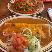 Whole pinto (not refried) burrito, smothered with vegetarian green chili, no cheese, no dairy, and added fajita veggies (told this could be on the side only). at D'Corazon Mexican Restaurant in Denver