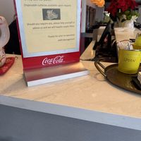 Sign at the cashier desk  at Asian Wok n Roll - Millcreek Dr in Mississauga