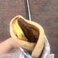 Impossible sausage, just egg, tater tots and vegan cheese on a very fluffy bread  at Disneyland - Shawarma Palace - Food Stand in Anaheim