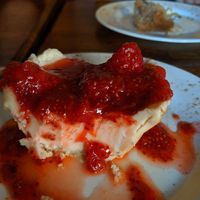 Baked cheesecake with strawberry topping at Seasoned Vegan in New York City