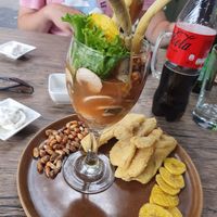 Leche de tigre with crispy corn, chicharron and fried plantain crisps at El Chino Vegano in Lima