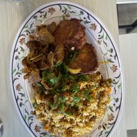 Beef and onion, tofu egg fritter with fried rice  at The Vegan Shop in Hilo