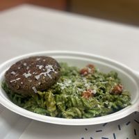 Pesto pasta with a lentil burger  at Holy Plants in Lima