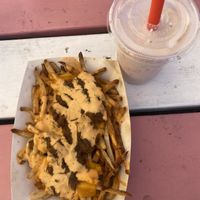 Loaded vegan fries and a vegan strawberry shake!  at Herbie's Burgers in Albany