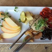 Paté Platter: Lentil-pecan paté, red onion confit, house made pickles, croccantini, fresh fruit. at Cafe Flora in Seattle
