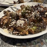 Crispy Brussels Sprouts with maple-chili oil (and a LOT of sesame seeds)  at Cafe Flora in Seattle