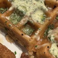 Fried King Oyster Mushroom and Roasted Potato Scallion Waffle + onion rings and hot (vegan) butter.   at Cafe Flora in Seattle