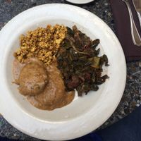 The vegan version of the Southern Platter. Biscuits and gravy, tofu scramble, and collards. The biscuits and tofu scramble in this dish are consistently perfect.  at Cafe Flora in Seattle