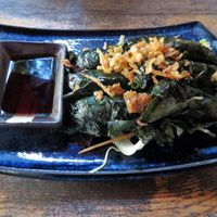 Vietnamese stater: tofu, mushrooms and vegan "duck" wrapped in (can't remember) leaf. Super tasty sauce too! at Rou Vegan in Berlin